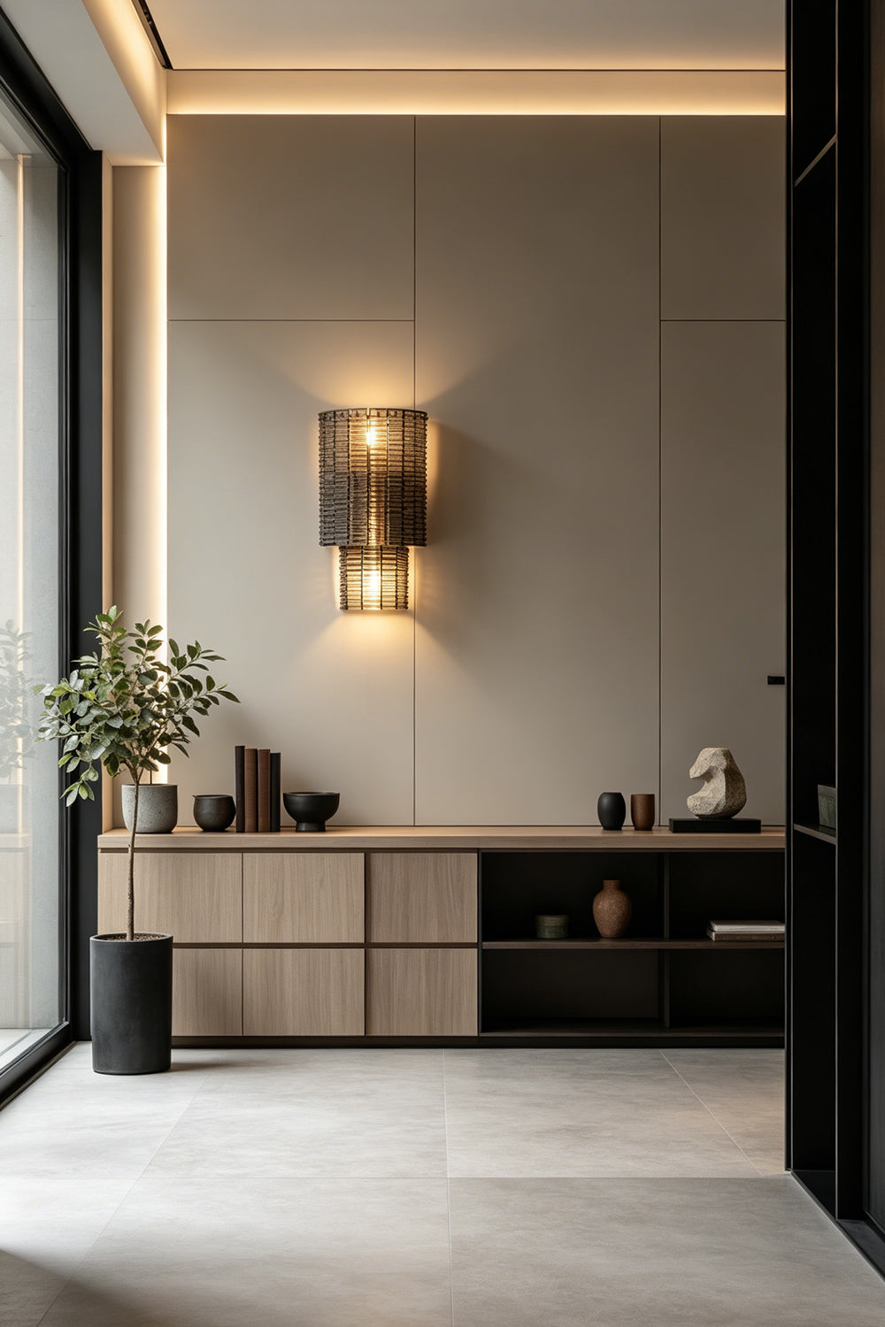 Sovereign Lattice Smoky Glass Wall Lamp illuminating a modern interior with decorative plants and minimalist decor.