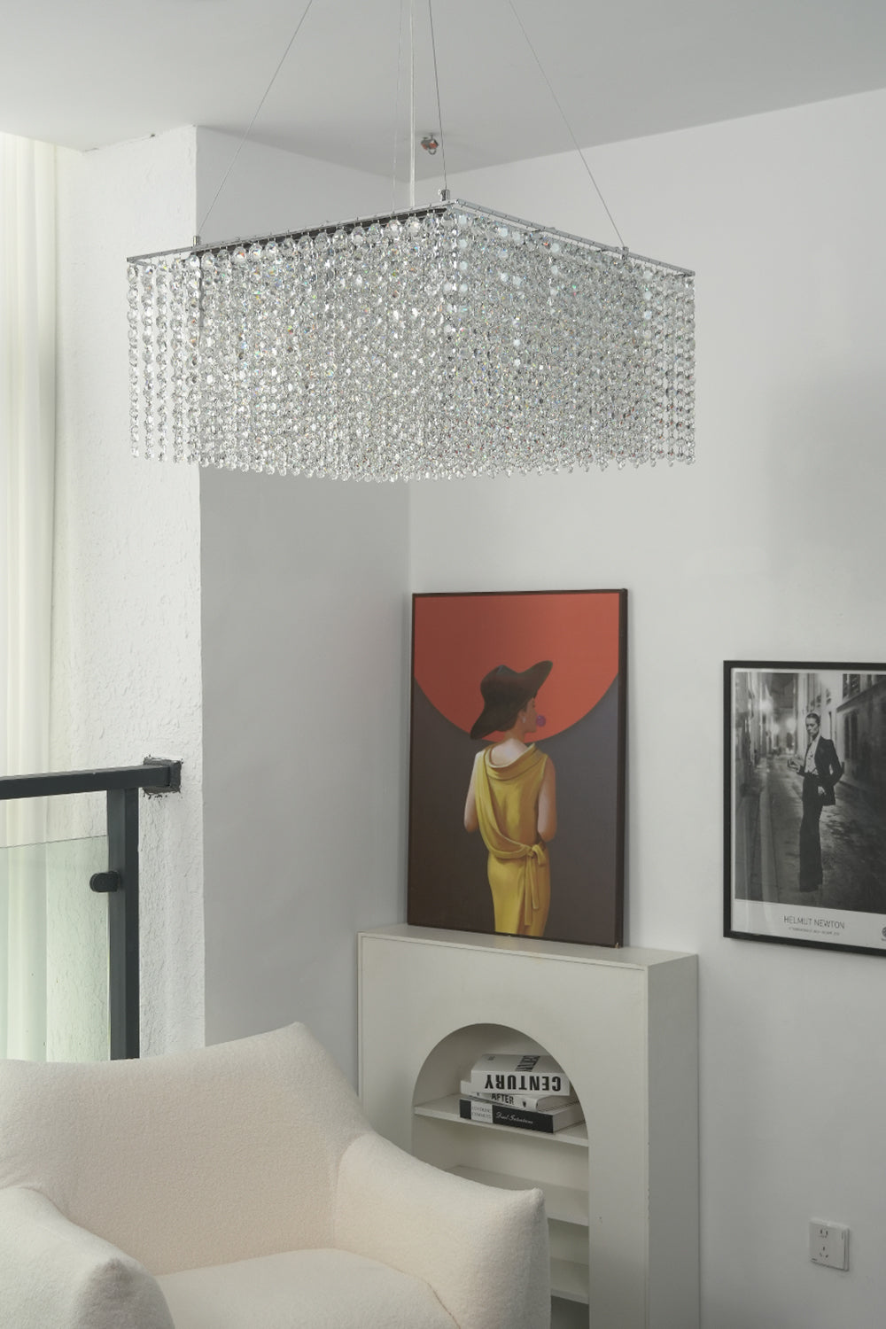 Sparkling crystal pendant light in a minimalist interior | Stainless Steel, Crystal | View from a hallway showing the chandelier and wall art | vexa lamps