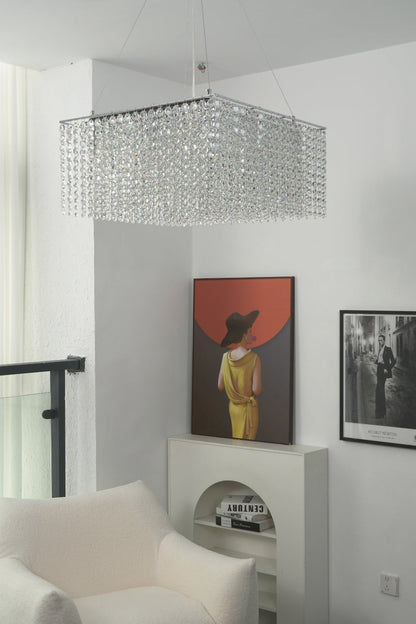 Sparkling crystal pendant light in a minimalist interior | Stainless Steel, Crystal | View from a hallway showing the chandelier and wall art | vexa lamps