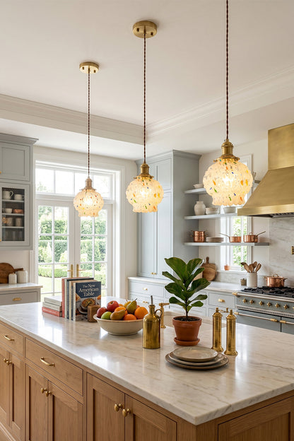 Speckled Bubble Glass Pendant Lamp | Glass, Metal | A trio of speckled glass pendants lined up over a modern light wood kitchen island in a bright home kitchen | vexa lamps