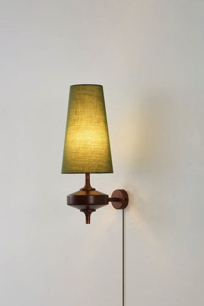 Spindle Walnut Wood Wall Sconce featuring a green tapered fabric shade and walnut finish for modern accent lighting.