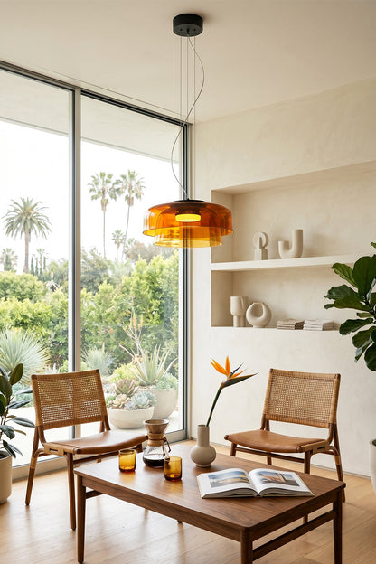 Stratum Layered Glass Pendant Light | Glass, Metal | Orange variant adding a retro touch over a wooden coffee table and rattan chairs near a glass patio door | vexa lamps