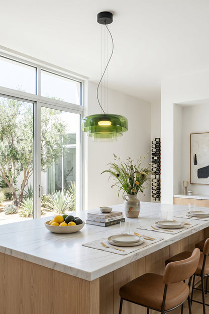 Stratum Layered Glass Pendant Light | Glass, Metal | Vibrant green variant illuminating a bright white marble kitchen countertop and dining area | vexa lamps