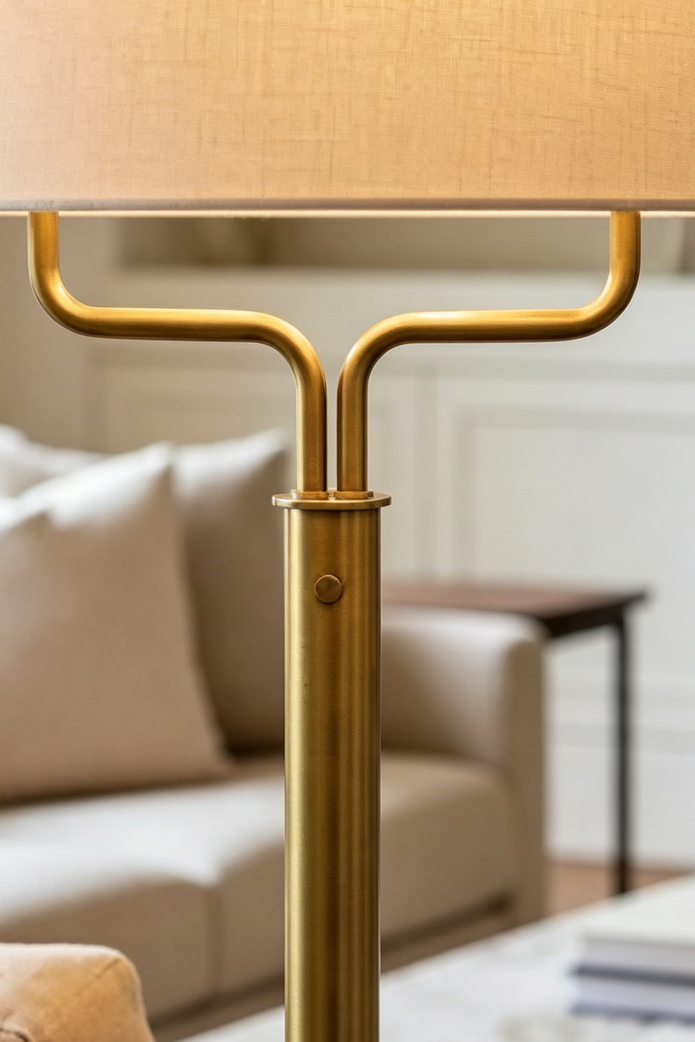 Close-up of the Sutton Modern Brass Floor Lamp showcasing its antique brass finish and linen drum shade.