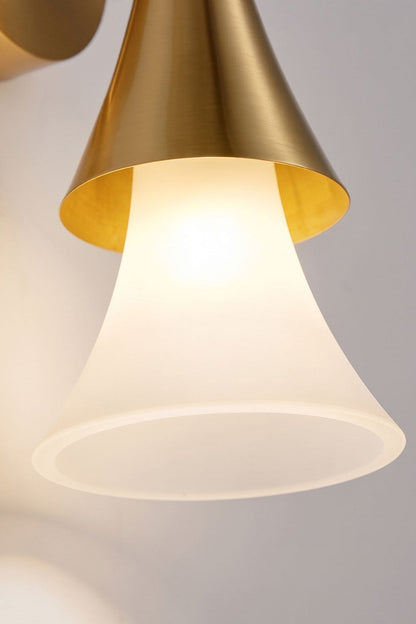 Sylvain Modern Torch Wall Sconce featuring a trumpet-shaped frosted glass shade and metallic accent.