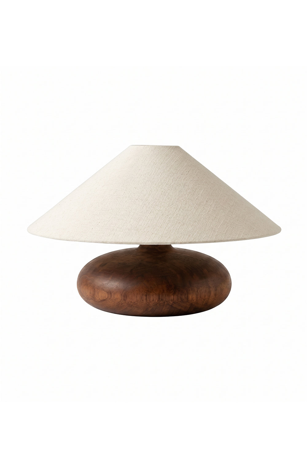 Sylvan Oval Walnut Table Lamp | Wood, Fabric, Metal | Low-profile table lamp with a wide conical beige fabric shade and a smooth oval walnut wood base | Isolated lit product shot on white background | vexa lamps