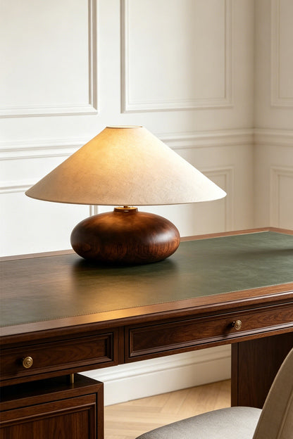Sylvan Oval Walnut Table Lamp | Wood, Fabric, Metal | Placed on a classic dark wood desk with a green leather top against a white paneled wall | vexa lamps