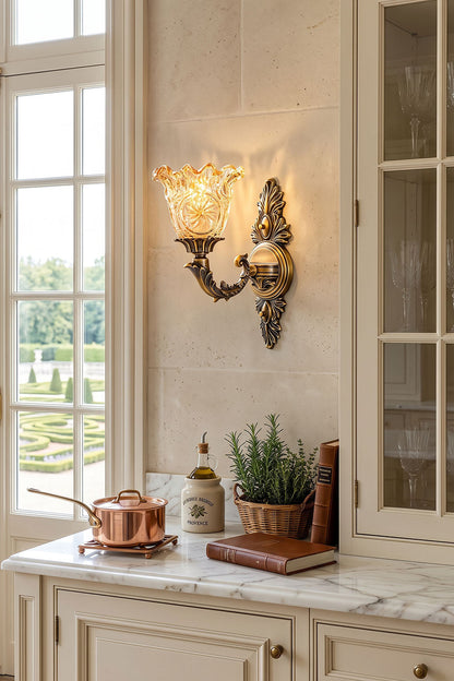 Sylvestre Petal Glass Brass Wall Lamp elegantly illuminating a kitchen space with vintage decor.