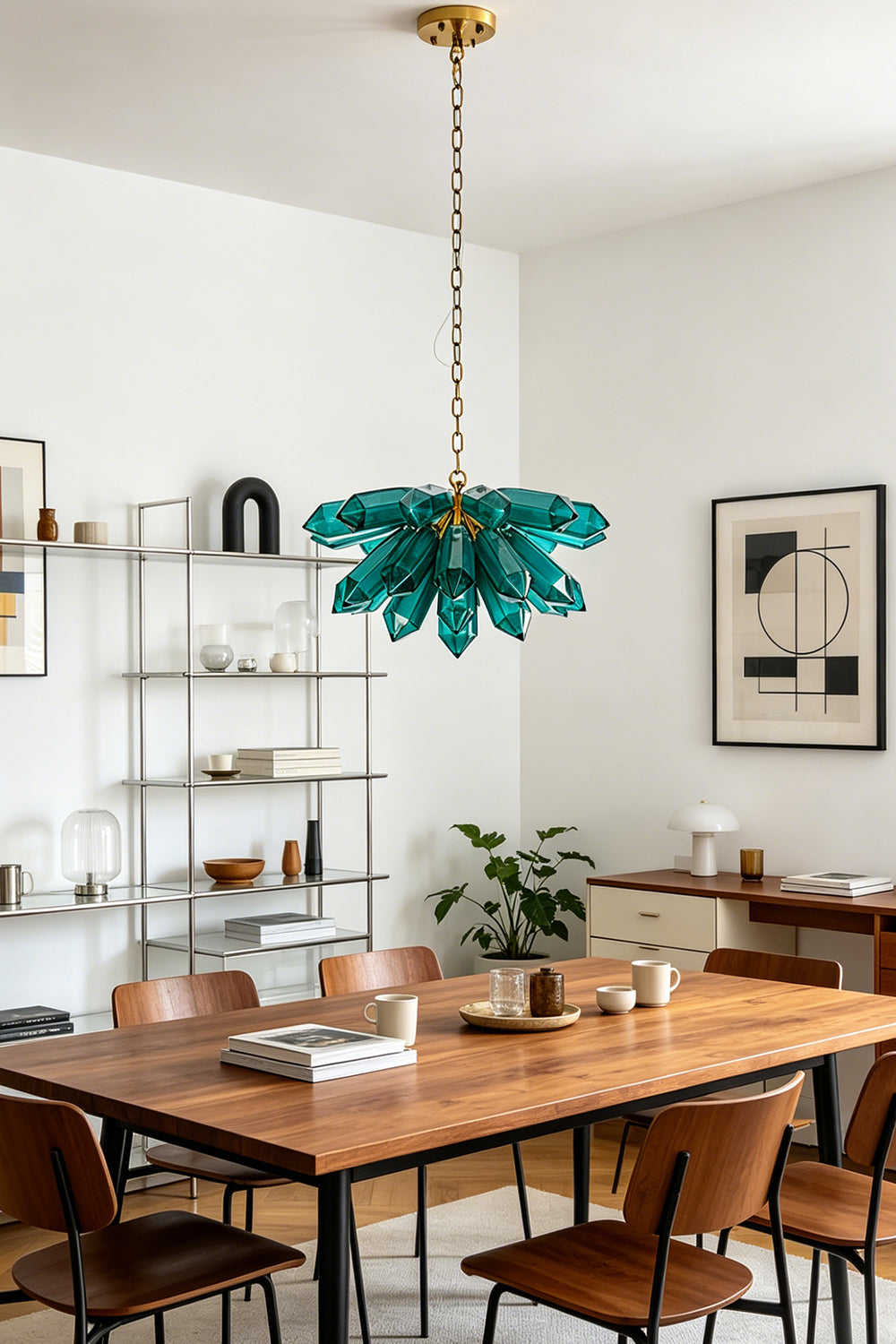 Artistic teal crystal cluster pendant light | Metal | Glass | Hanging over a wooden dining table with leather chairs | vexa lamps