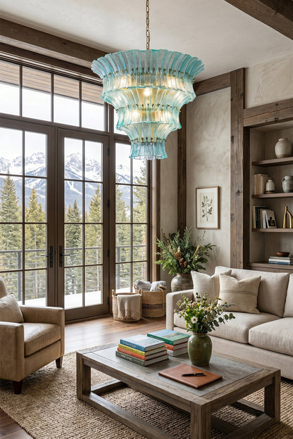 Thalassa Aquamarine Textured Glass Chandelier | Glass, Metal | Installed as a grand overhead lighting statement centerpiece in a mountain lodge living room with a cream sofa and high wood beams | vexa lamps