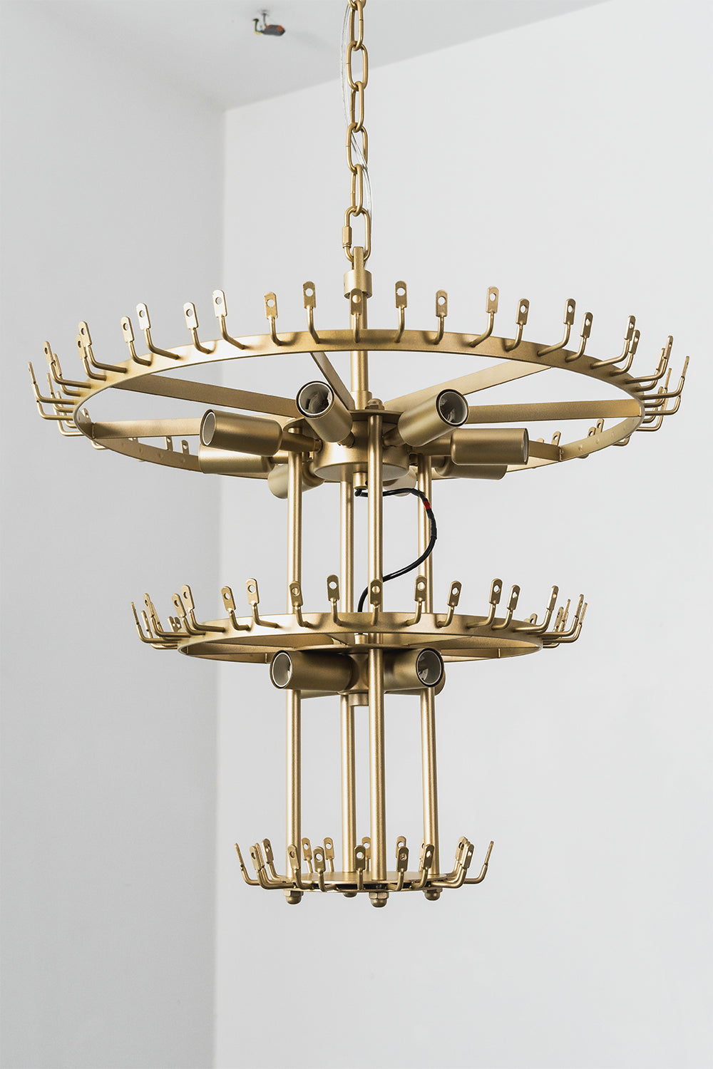 Thalassa Aquamarine Textured Glass Chandelier | Glass, Metal | Clear view of the raw unlit double-tiered gold brass frame skeleton showing empty ring bands with hooks for glass attachment | Detail shot | vexa lamps