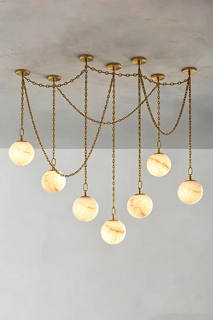 Thalia Alabaster Spherical Chain Chandelier with hand-carved alabaster spheres and brushed links.
