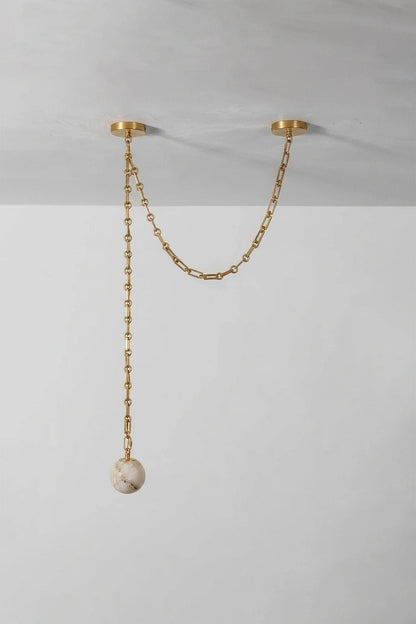 Thalia Alabaster Spherical Chain Chandelier with hand-carved alabaster spheres and brushed links.