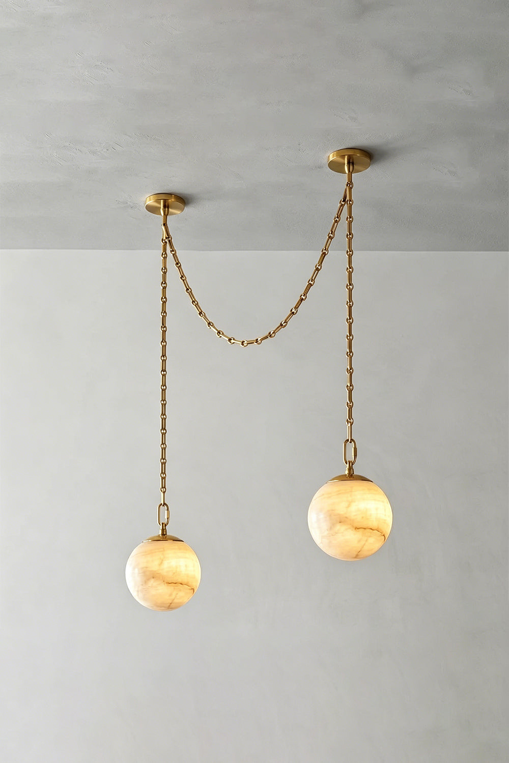 Thalia Alabaster Spherical Chain Chandelier with hand-carved alabaster spheres and brushed links.