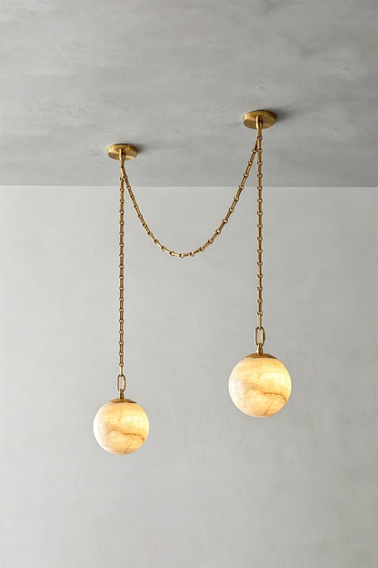 Thalia Alabaster Spherical Chain Chandelier with hand-carved alabaster spheres and brushed links.