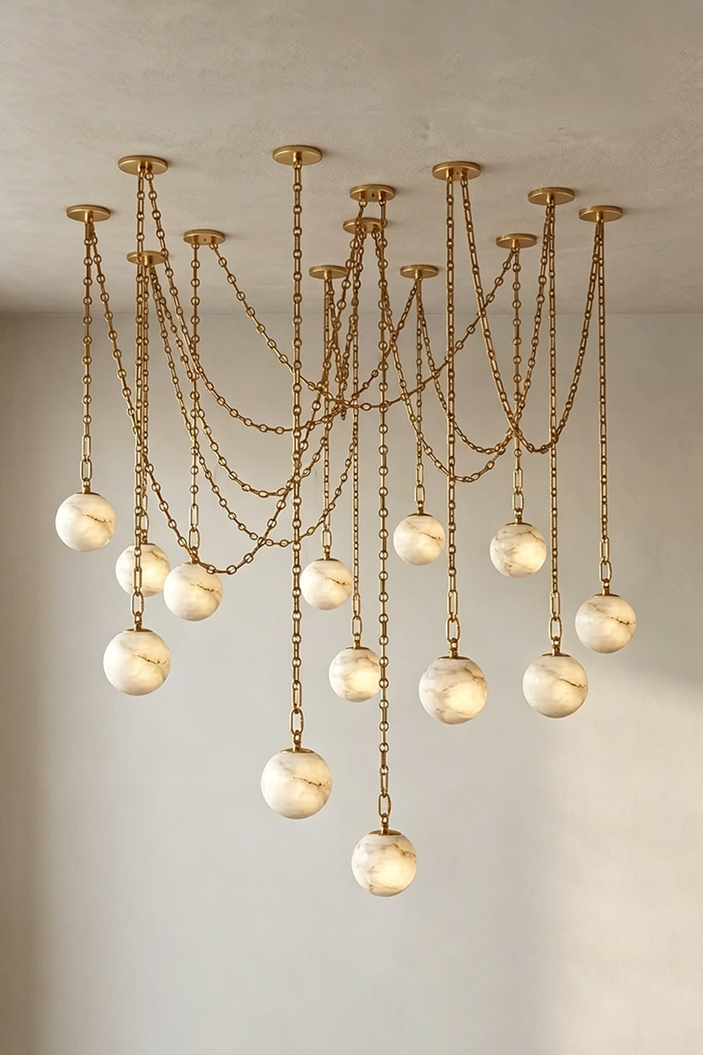 Thalia Alabaster Spherical Chain Chandelier with hand-carved alabaster spheres and brushed links.