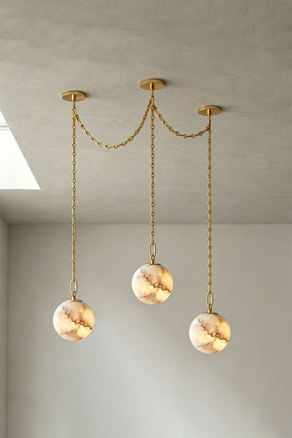 Thalia Alabaster Spherical Chain Chandelier with hand-carved alabaster spheres and brushed links.