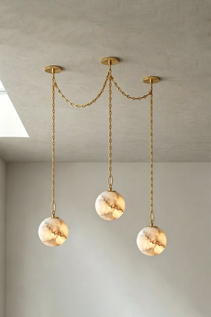 Thalia Alabaster Spherical Chain Chandelier with hand-carved alabaster spheres and brushed links.