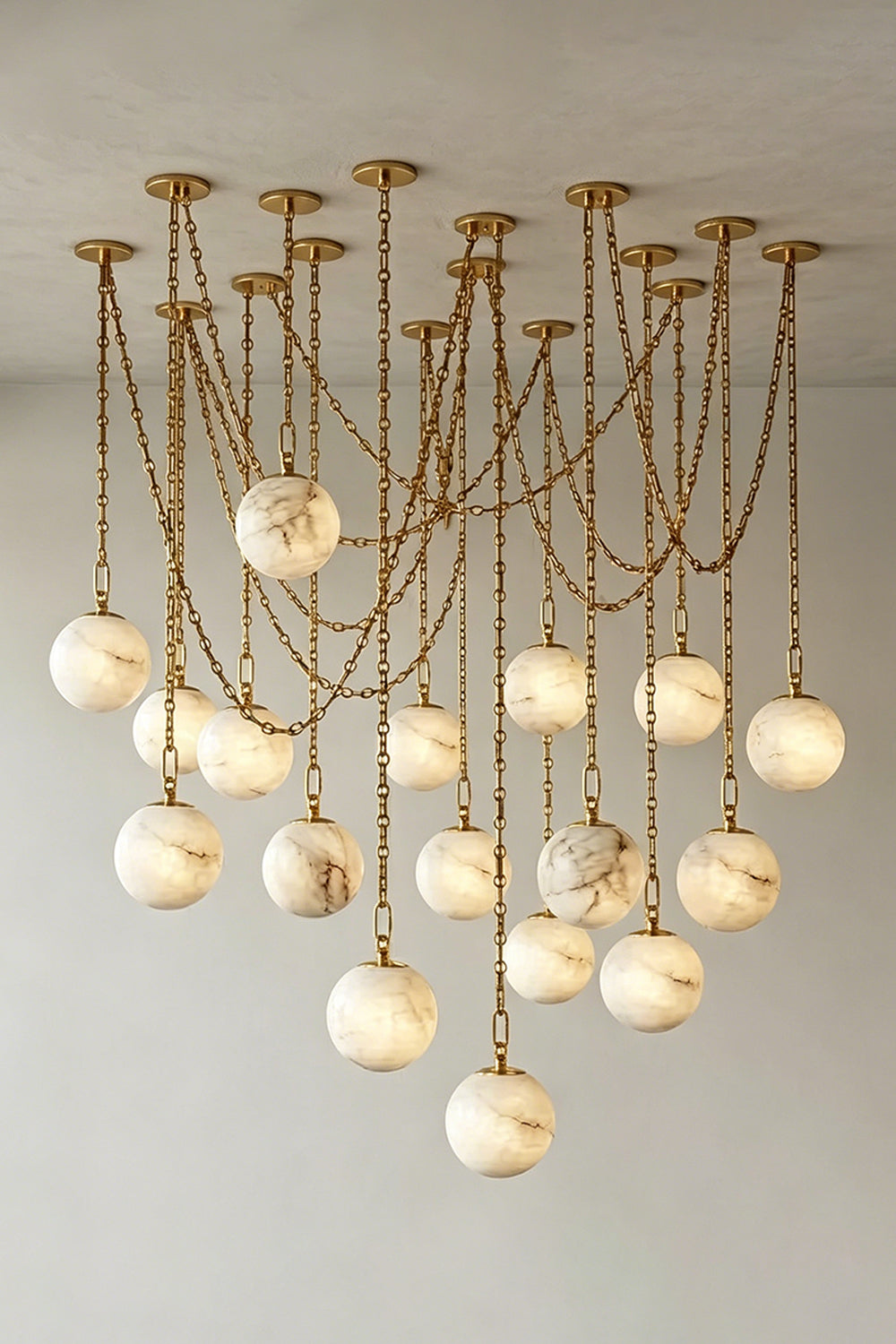 Thalia Alabaster Spherical Chain Chandelier with hand-carved alabaster spheres and brushed links.