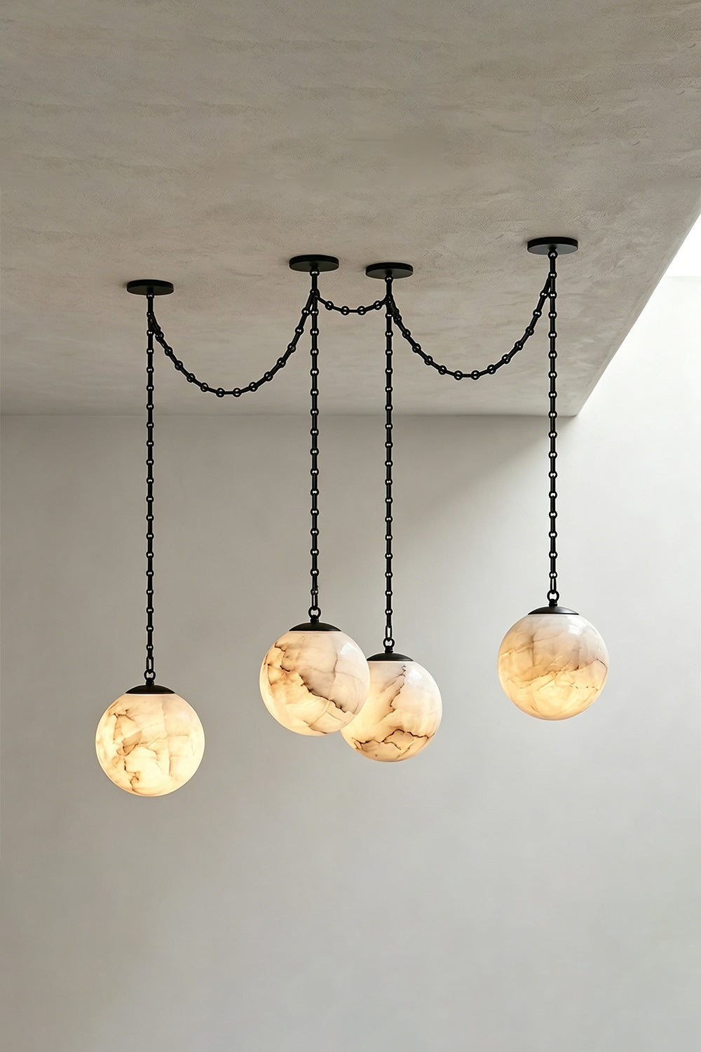 Thalia Alabaster Spherical Chain Chandelier with hand-carved alabaster spheres and brushed links.
