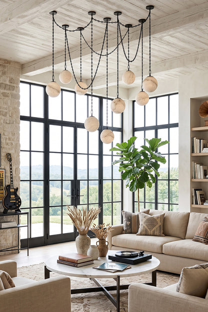 Thalia Alabaster Spherical Chain Chandelier showcasing seven hand-carved alabaster spheres in a stylish living room.