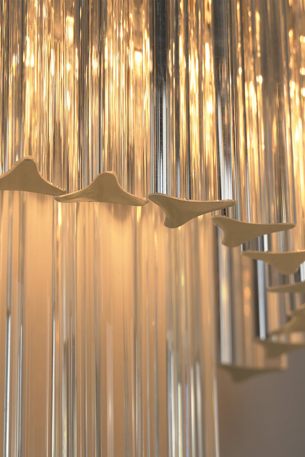 Angled close-up of lit glass rods | Metal, Glass | Detail view showing rod texture | everlamps