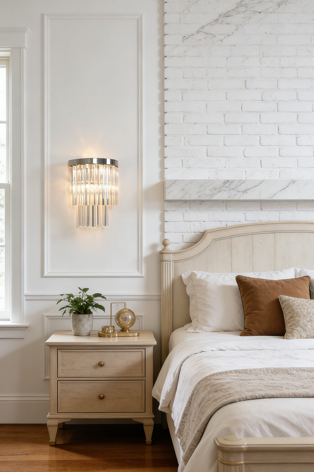 Lit tiered column glass wall light | Metal, Glass | Installed on a classic white wall over a bedside nightstand | everlamps