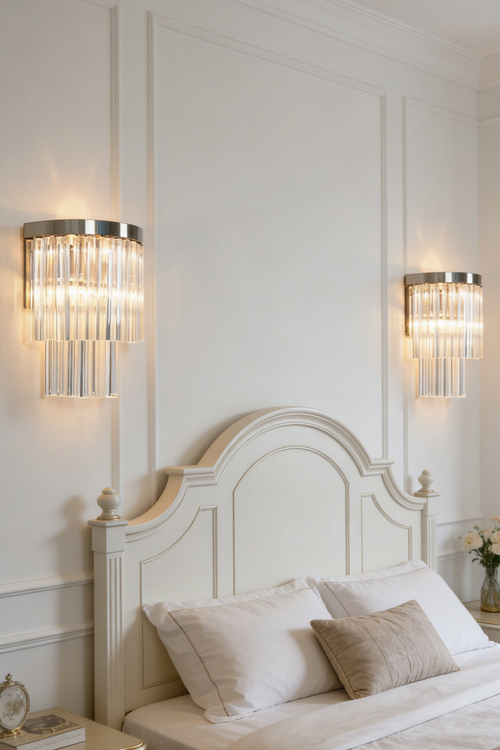 Lit tiered column glass wall light | Metal, Glass | Installed on a classic white wall over a bedside nightstand | everlamps