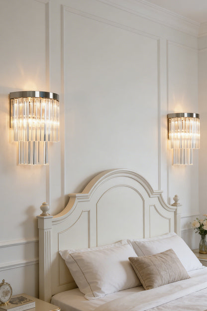 Lit tiered column glass wall light | Metal, Glass | Installed on a classic white wall over a bedside nightstand | everlamps