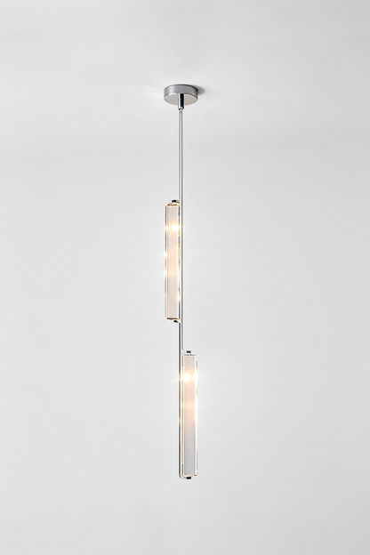 Torvald Crystal Bar Drop Pendant Light hanging from the ceiling, showcasing its sleek and modern design with elegant glass accents.
