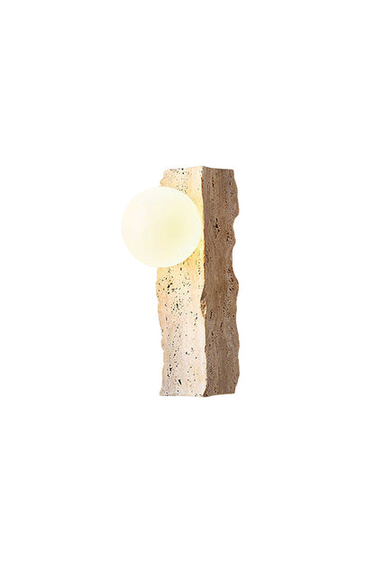 Lit travertine block wall sconce with round glass globe | Yellow Travertine, Metal, Glass | Front view isolated on white background | vexa lamps