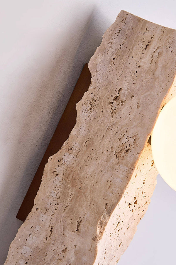 Close-up of raw travertine texture and glass globe | Yellow Travertine | Macro shot showing the rough stone edge and warm light | vexa lamps