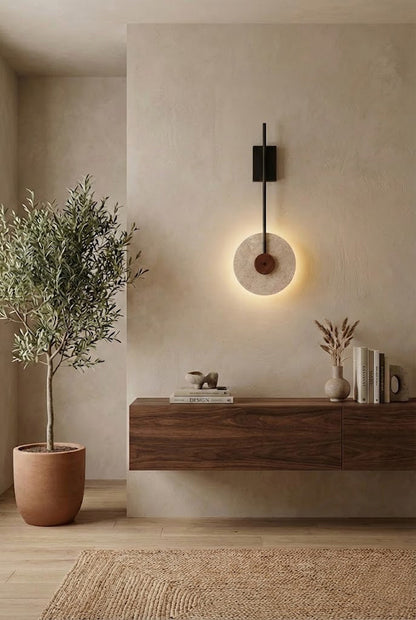 Travertine halo wall light in a Wabi-Sabi interior | Travertine, Wood, Metal | Mounted above a floating wooden console | vexa lamps