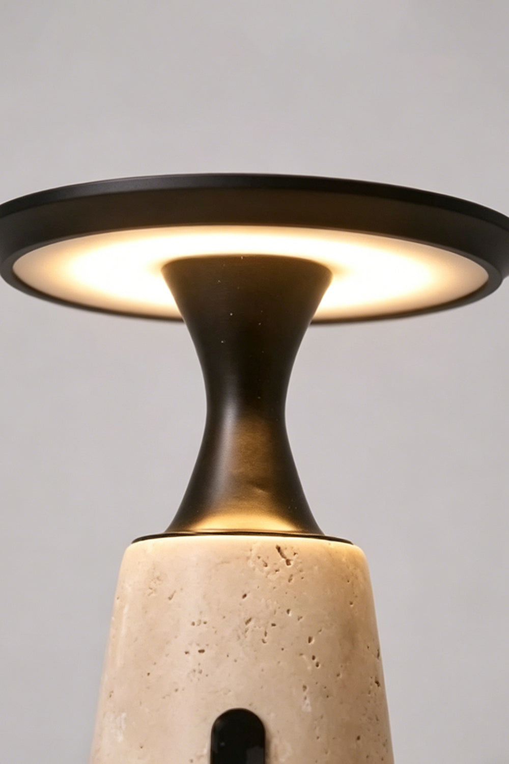 Travertine Obelisk Table Lamp detail | Metal, Travertine | Close-up of light diffusion under the disc | vexa lamps