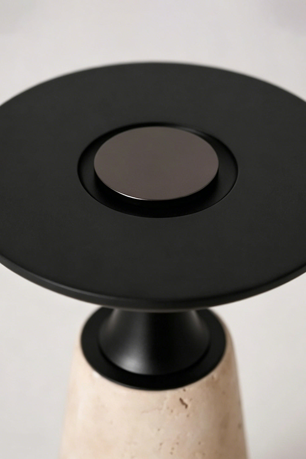 Travertine Obelisk Table Lamp detail | Metal | Top-down view of black metal finish and button | vexa lamps