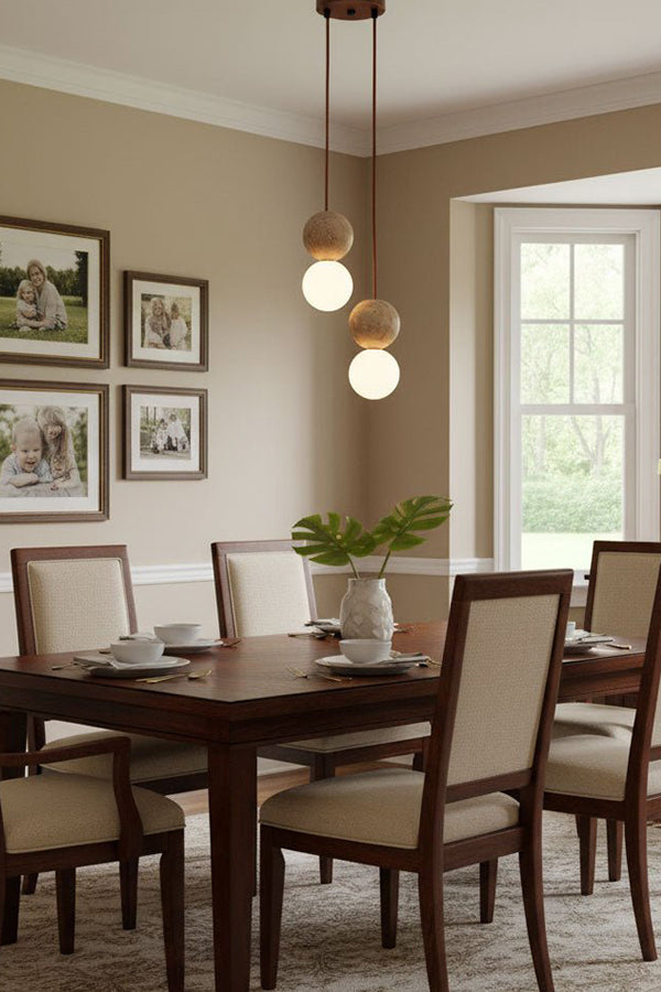 Pair of travertine stone pendants in a corner | Yellow Travertine, Glass | Traditional dining room scene with wooden furniture | vexa lamps
