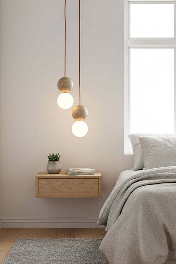 2-light cluster travertine bedside pendant | Yellow Travertine, Glass | Installed over a floating wooden nightstand | vexa lamps