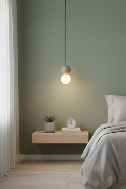 Single travertine stone pendant light | Yellow Travertine, Glass | Minimalist bedside installation in a bright room | vexa lamps