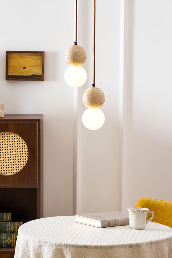 2-light cluster travertine pendant lamp | Yellow Travertine, Glass | Hanging over a small round table with a yellow chair | vexa lamps