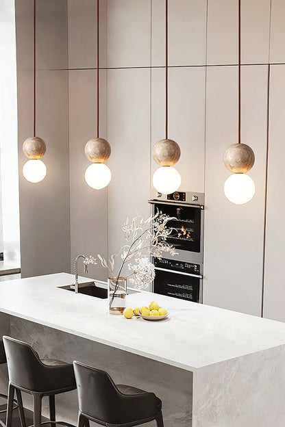 4-light linear travertine pendant light | Yellow Travertine, Glass | Kitchen island installation with sleek modern decor | vexa lamps