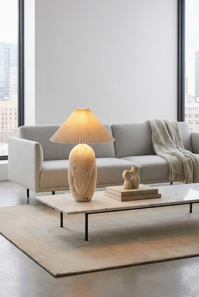 Statement stone table lamp | Travertine, Fabric | Centered on a large coffee table in a modern lounge | vexa lamps