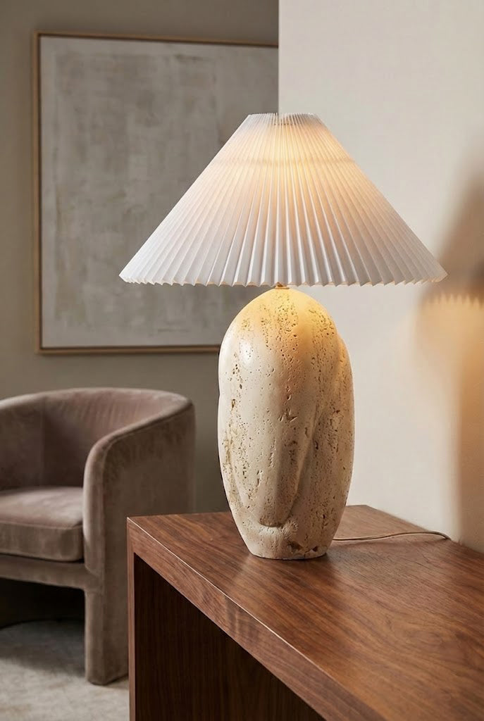 Lit travertine table lamp with warm glow | Travertine, Fabric | Side view on a wooden console table | vexa lamps
