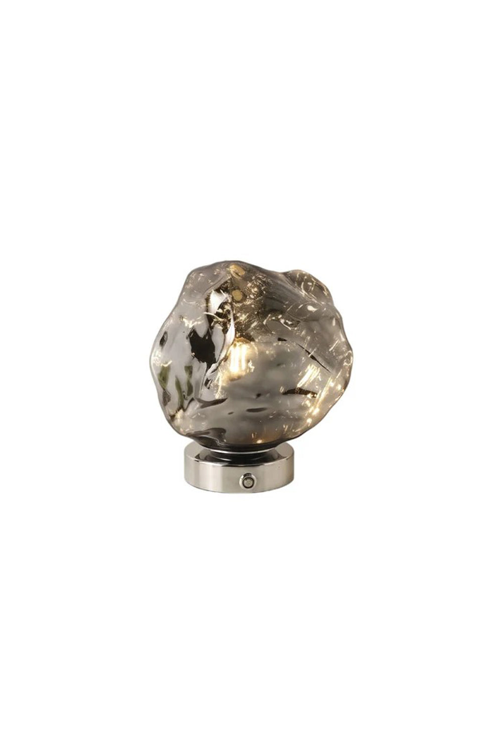 Vega Molten Metal Table Lamp showcasing a sculptural design with a highly reflective irregular base.