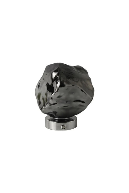 Vega Molten Metal Table Lamp showcasing fluid metal design with high-sheen base, ideal for modern decor.