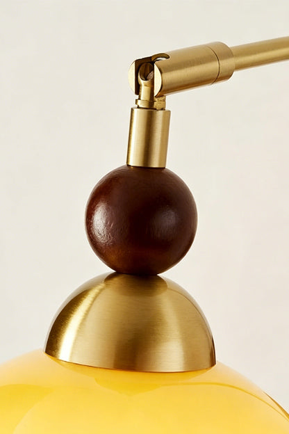 Vesper Caramel Gradient Wall Lamp | Glass, Metal, Wood | Detailed close-up showing the spherical dark wood bead accent and polished gold brass socket cap assembly | Detail shot | vexa lamps