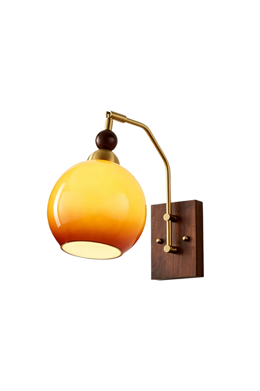 Vesper Caramel Gradient Wall Lamp | Glass, Metal, Wood | Mid-century modern wall sconce with a glossy caramel gradient glass globe shade, a curved brass arm, and a dark
