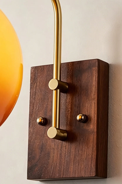 Vesper Caramel Gradient Wall Lamp | Glass, Metal, Wood | Close-up focus on the rich grain of the rectangular dark wood wall canopy and the brass mounting screws | Detail shot | vexa lamps