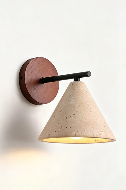 Vesper Cone Travertine Wall Light | Travertine, Wood | Side perspective of lit product on wall | vexa lamps