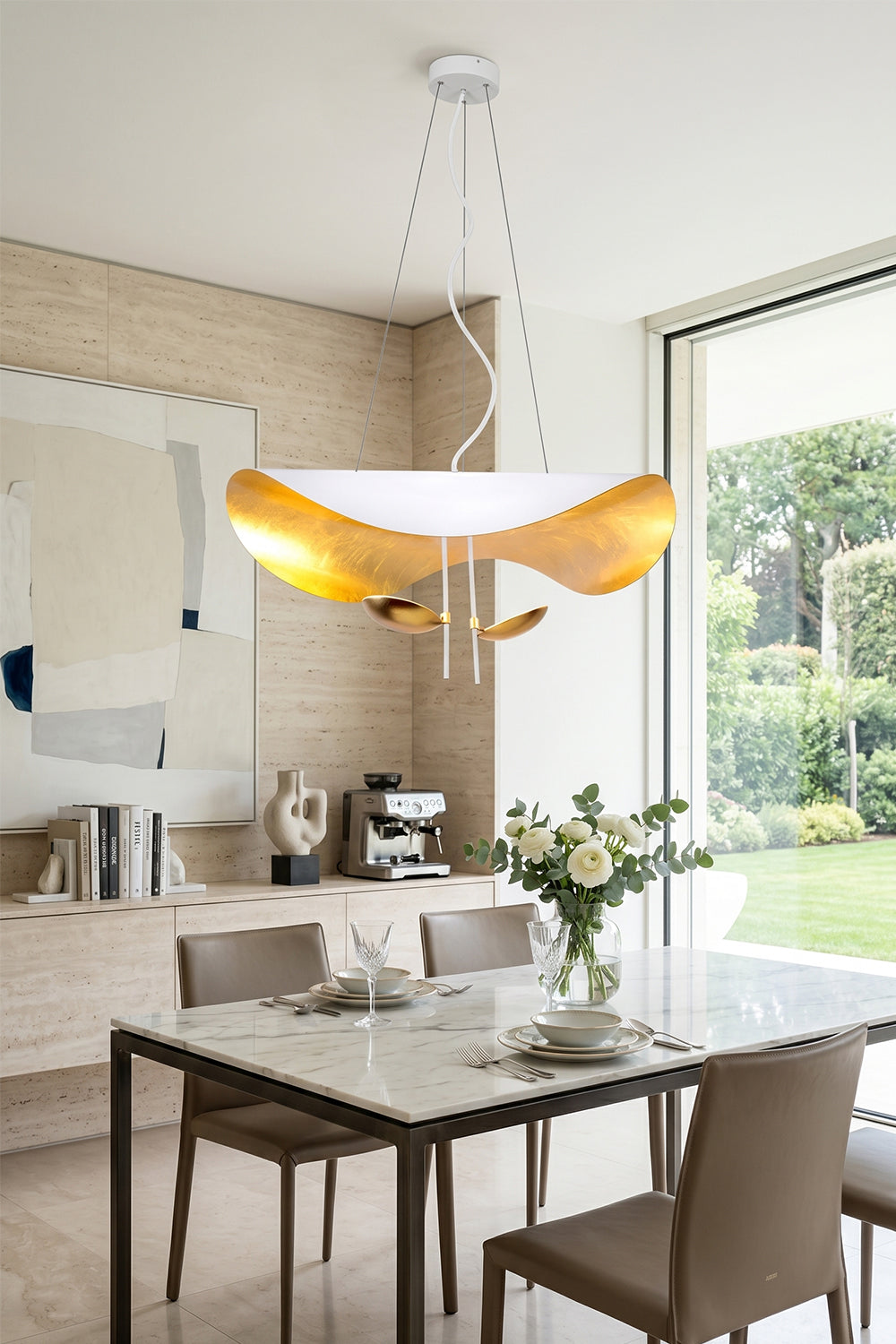 Voluta Horizon Metal Pendant Light | Metal | White and gold variant installed over a contemporary dining set in a bright room with large windows | vexa lamps