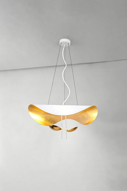 Voluta Horizon Metal Pendant Light | Metal | White and gold variant illuminated against a simple plain wall corner | vexa lamps
